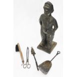 A bronzed metal fireside companion, modelled in the form of Dutch child, 51cm high.