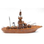 A hardwood and aluminium scratch built model of a Frigate, with three gun turrets, etc., 47cm long.