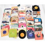 A quantity of 45rpm singles, to include Status Quo, Wham, Sophia Loren, etc. (AF)