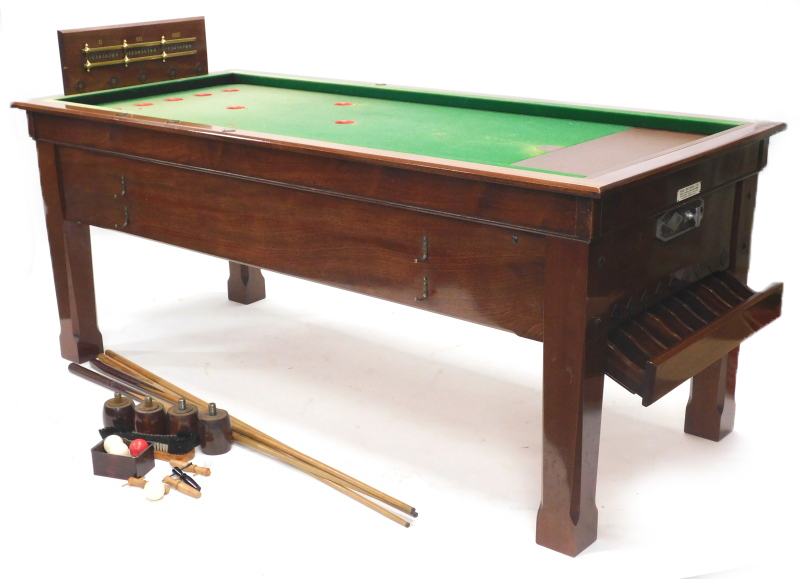 A Sams Brothers Limited mahogany coin operated bar billiards table, with various cues, etc.