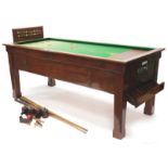 A Sams Brothers Limited mahogany coin operated bar billiards table, with various cues, etc.
