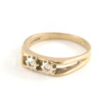 A Romette 9ct gold dress ring, set with two illusion set tiny diamonds, with V splayed shoulders,