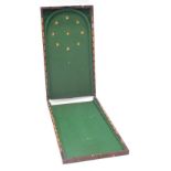 A late 19th/ early 20thC mahogany bagatelle game, with inlaid scorers to the sides, (AF), 91cm high,