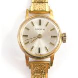 An Ingersol ladies wristwatch, with silvered coloured dial with stainless steel back, on a gold