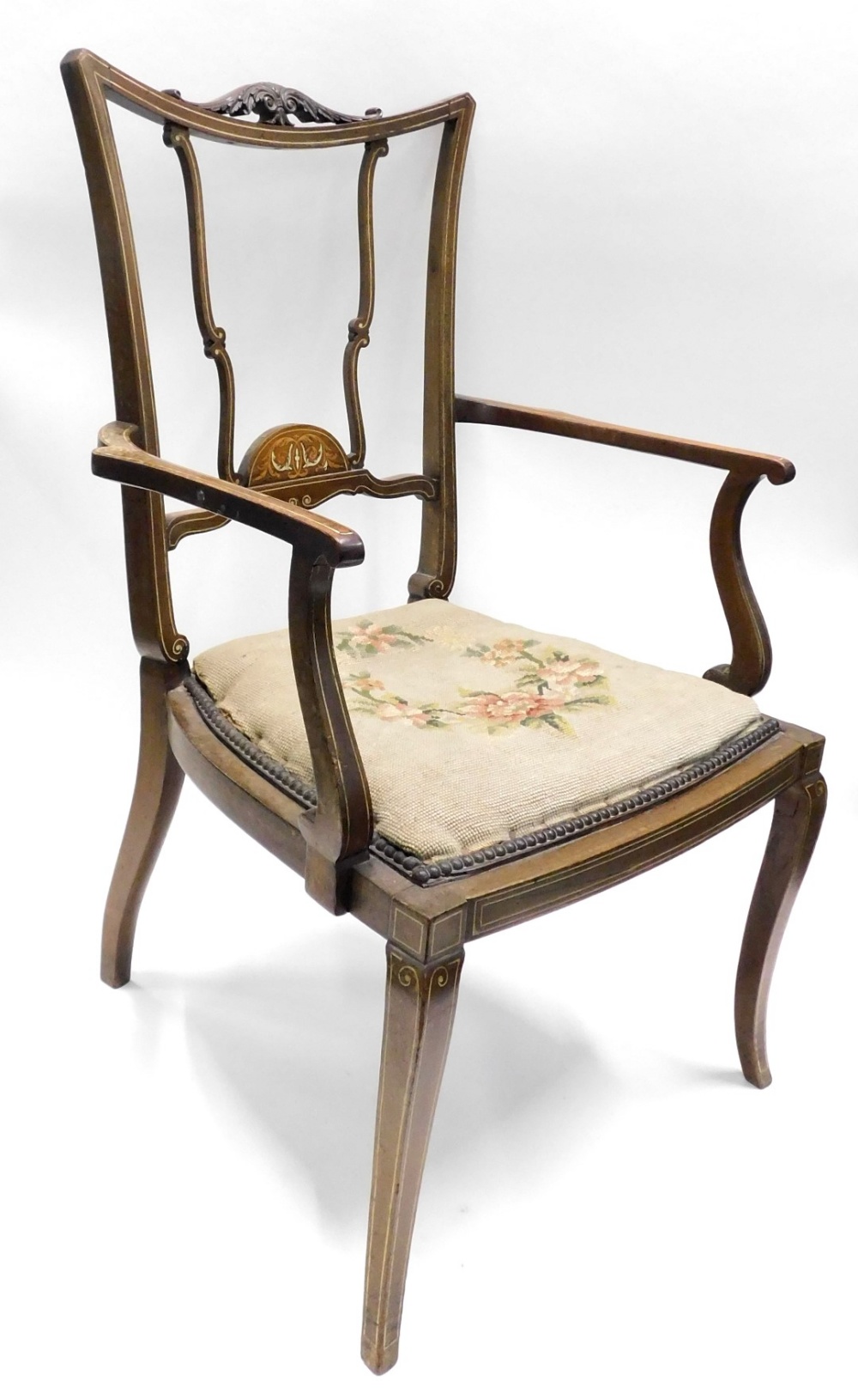 An Edwardian mahogany and inlaid open armchair, with padded seat on splayed legs.