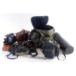 A collection of cameras, binoculars etc., to include a Kodak Brownie camera, a Prakica camera,
