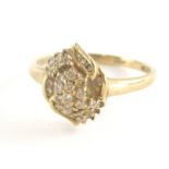 A 9ct gold dress ring, with central cross over floral detailing set with cz stones, in claw and