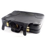 A Pampas and Rind black vintage leather suitcase, with brass mounts, (AF).