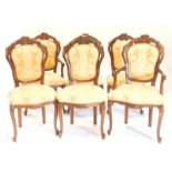 A set of six continental stained beech dining chairs, each with yellow upholstery on cabriole