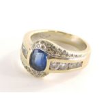 A sapphire and diamond dress ring, with oval sapphire in rub over setting, approx 1.43cts, white