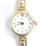 A 9ct gold Accurist ladies wristwatch, with white dial, on a pleated design 9ct gold bracelet in 9ct