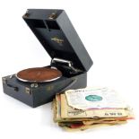 A wind up portable Columbia gramophone, and various 78rpm records, to include Paul Anka, Guy