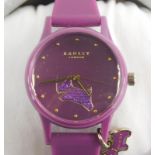 A Radley London ladies wristwatch, on purple plastic strap, with dial depicting Radley dog in