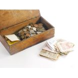 A large quantity of British and foreign coins and bank notes, to include German, etc.