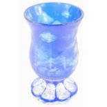 A Bohemian engraved glass goblet, decorated with Alpine landscape with trees, mountains, log cabins,