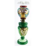 A Victorian opaque glass oil lamp, decorated with an arrangement of flowers, leaves, etc., 55cm