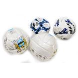 Two Manchester City signed footballs, and two others.