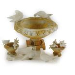 A 20thC marbled centrepiece, formed as an urn with floral outline, set with various doves, the