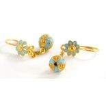 A pair of Eastern style enamel drop earrings, each with pale blue enamel flower and ball design,