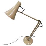 A grey adjustable anglepoise desk lamp.