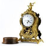 A 19thC French mantel timepiece, in brass case, decorated with Neoclassical figures, etc., the white