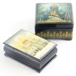 Two 20thC Russian lacquered boxes, each decorated with depictions of Russian Orthodox churches,