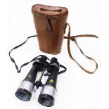 A pair of Barr and Stroud military issue binoculars, in leather case.