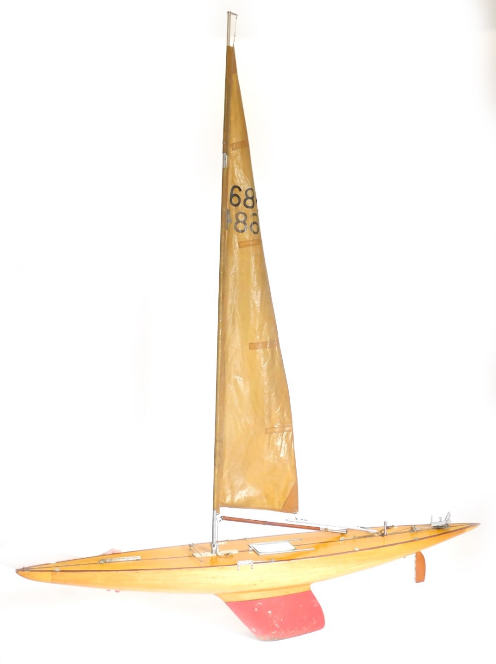 A 1960s/ 70s canoe stern ten raiter plank on frame pond yacht, pennant number 1684, 193cm wide.