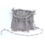 A mid 20thC Art Deco chain mail evening purse, with paperclip hanger, 15cm wide, unmarked white