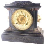 A late 19thC Ansonia mantel clock, in ebonised cast iron base decorated to simulate slate or marble,