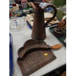 A hammered copper water jug, and crumb scoop, in crocodile skin type finish.