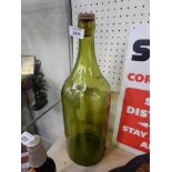 A large green glass bottle.