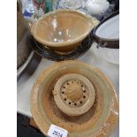 A studio pottery colander and bowl, by A & J Young, Gresham., together with a lemon squeezer, and a