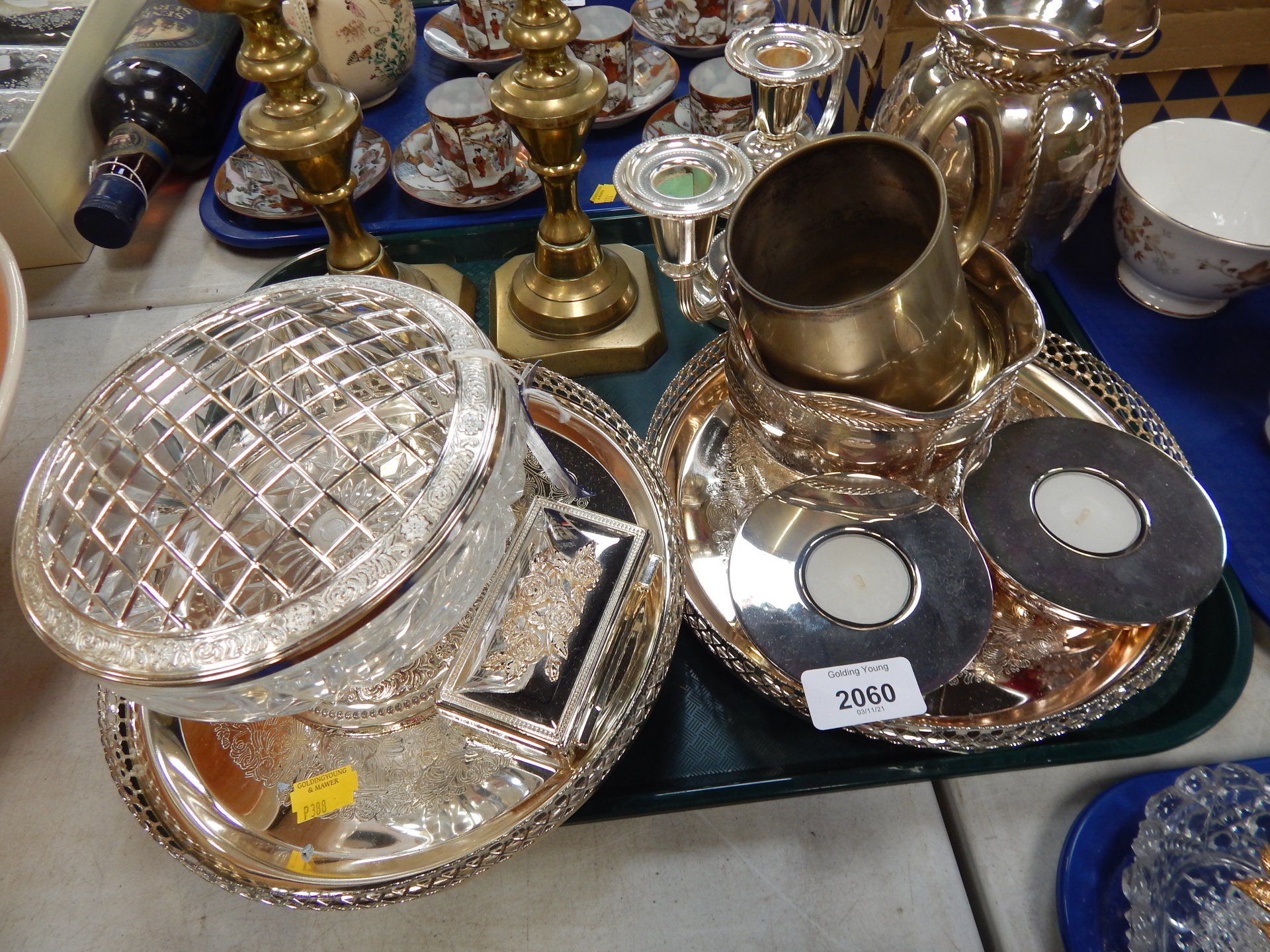 A group of silver plated wares, pair of brass candlesticks, ice pale, candelabrum, etc. (1 tray)