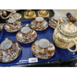 A set of six eggshell porcelain Japanese coffee cans, together with a satsuma saucier.