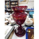 A Victorian glass lustre, with cranberry glass finish picked out in gilt, with some lustre drops. (h