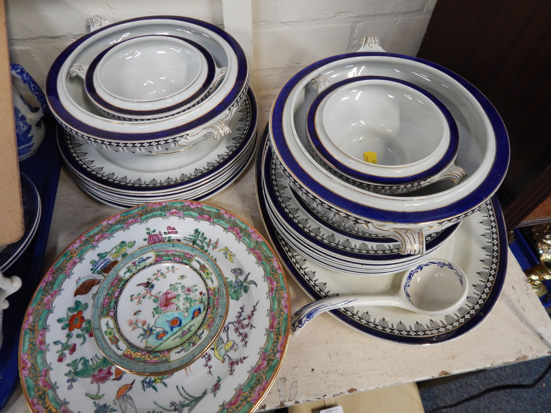 An Empress part dinner service, including oval meat plate, two large tureens and two smaller, dinner