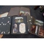 Four postcard albums, containing seaside and view point cards, in material albums.