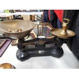 A Librasco table top black finish metal kitchen scale, with two bowls and various weights.