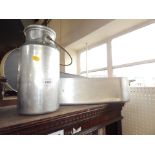 An aluminium milk canister and oval fish kettle. (2)