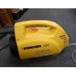 A Karcher 220 pressure washer.