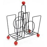 A 1950/60s 'Sputnik' wirework magazine rack, with red ball finial, on four red ball feet, 33cm high.