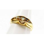 An 18ct gold opal and diamond gypsy ring, the central panel set with three opals and two tiny diamon