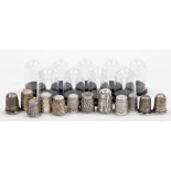 A group of twelve silver thimbles, each of varying design, some in thimble cases, 3½oz.