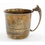 A George V silver small mug, with a cow head cast handle, the body with raised decoration, Birmingha