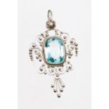 A pendant, with central blue paste stone, an outer filigree design detailing with single pendant loo