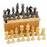 A 20thC Staunton style chess set, comprising black and white figures, the black king 6cm high, in pi