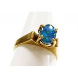 A 9ct gold opal dress ring, with single opal in four claw raised setting, stamped 9ct, rin