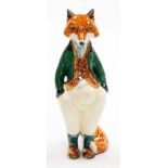A Rye pottery fox figure, of a gentleman fox in green waistcoat, marked C.P.P. Rye LB, 23cm high.