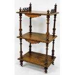 A Victorian walnut and chequer banded three tier whatnot, the part galleried top section raised with